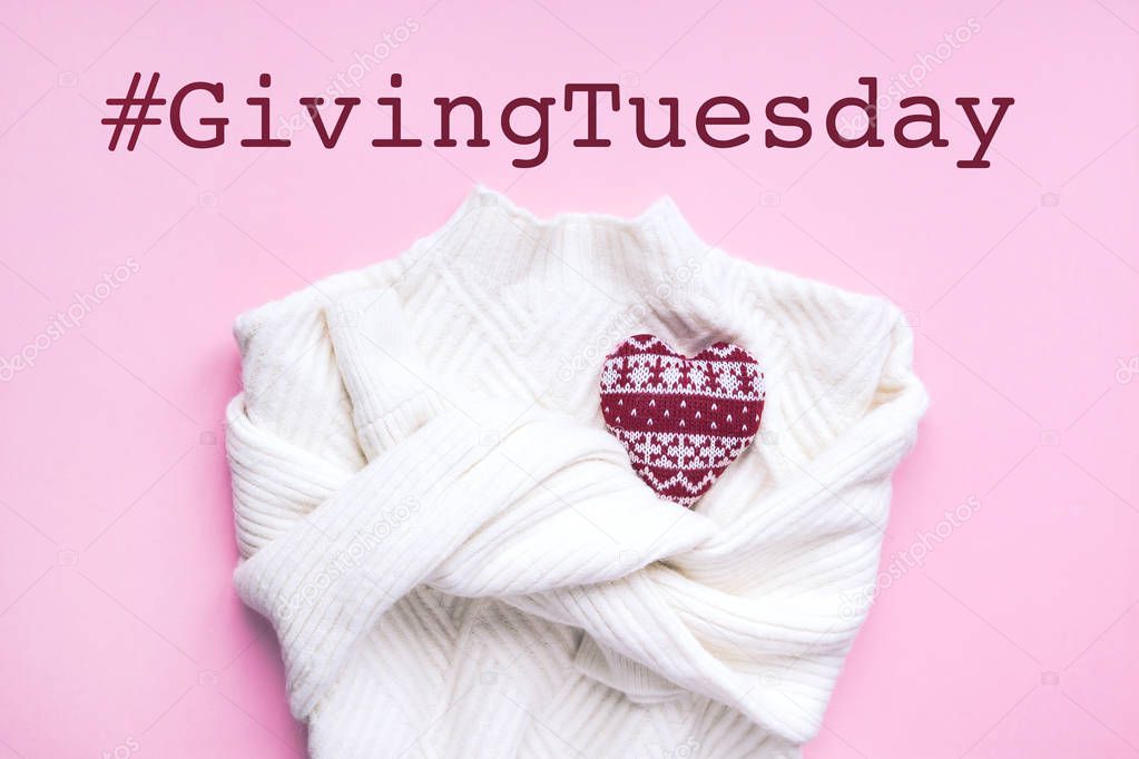 Giving Tuesday concept. Red heart on white sweater