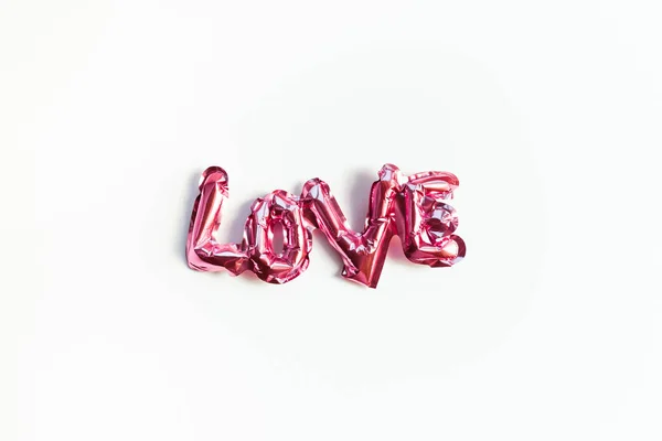 Concepto de amor. Globo rosa inflable con letras —  Fotos de Stock