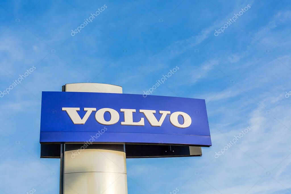 Volvo brand logo on bright blue sky background located on its sale office building in Lyon, France - February 23, 2020