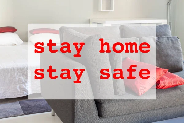 Stay home stay safe concept with flat interior and red text. Spending time home during Coronavirus pandemic quarantine isolation.