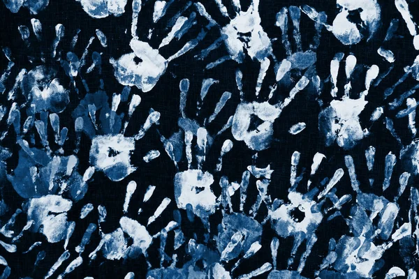 Human color handprints background. Color of the year 2020 classic blue toned
