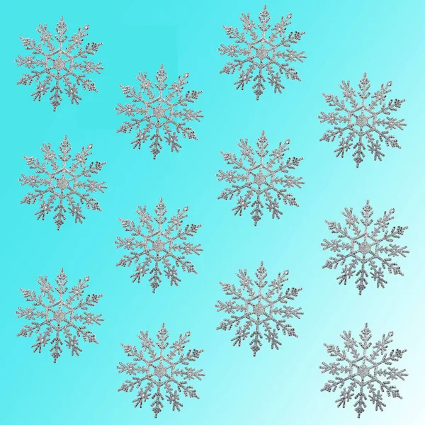 Silberne Schneeflocken isoliert auf blauem Hintergrund, Textur — Stockfoto