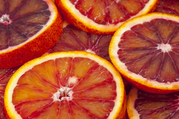 Red sicilian orange slices background