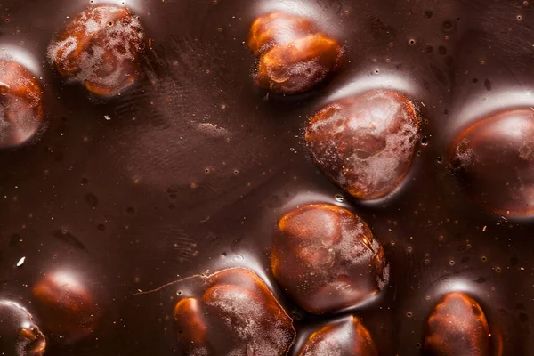 Μεγάλα Φουντούκια Μαύρη Σοκολάτα Φόντο Γλυκών — Φωτογραφία Αρχείου
