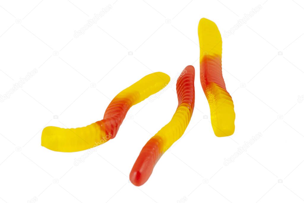 Jelly worms or snakes candies on a white background isolation