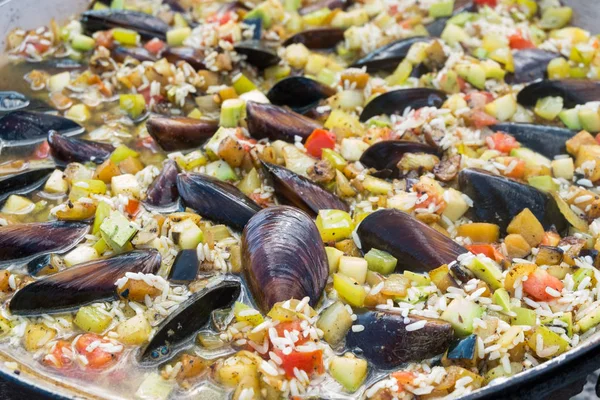 Process of cooking paella with seafood
