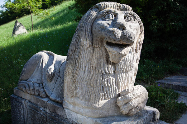 Olesko, Ukraine - 23 JULY 2009: Stony chapped figure of lion at entrance to Olesko Castle (Ukraine, Lvivska Region, built before 1390)