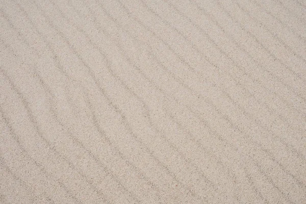 Areia na praia como fundo — Fotografia de Stock