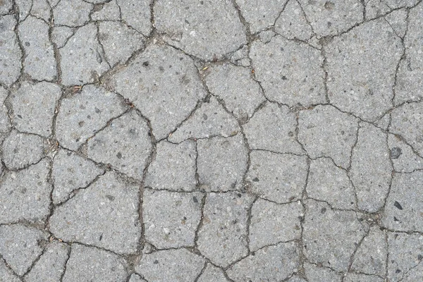 Vecchio fondo stradale - superficie di grigio incrinato asfalto texture — Foto Stock