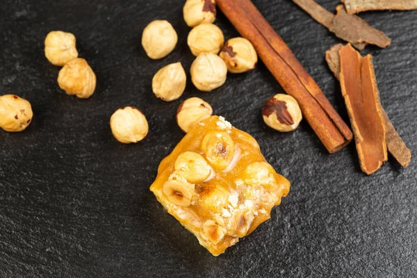 Homemade indian vegan sweet barfi. Chickpea fudge, hazelnut and coconut pulp with cinnamon