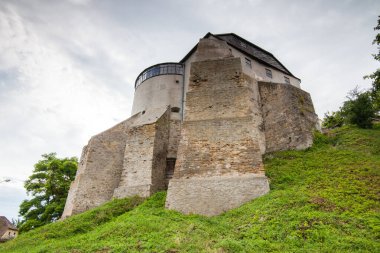 The Round tower of the Ostrog castle in western Ukraine. Bottom view of the walls, Rivne region, Ukraine clipart