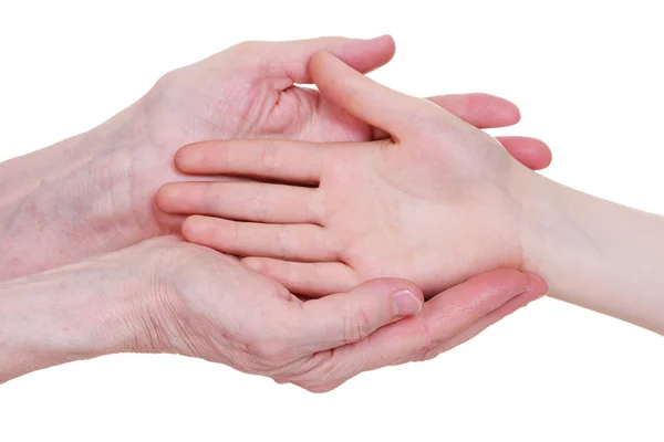 Viejos y jóvenes tomados de la mano, aislados sobre un fondo blanco . — Foto de Stock