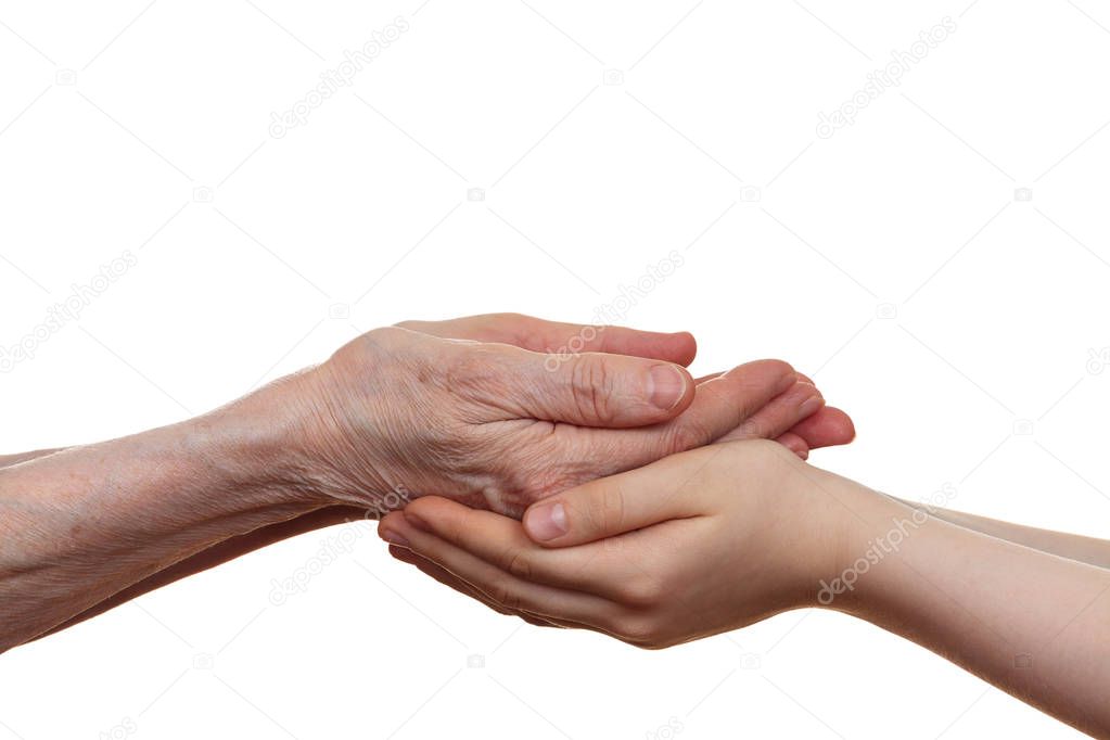 Old and young holding hands of each other, isolated on a white b