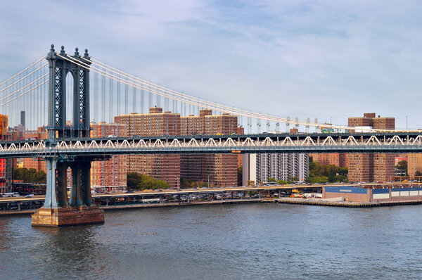 Fragment of Manhattan Bridge against a residential district.