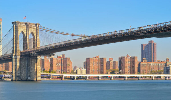 Panorama of Manhattan skyline with Brooklyn Bridge.