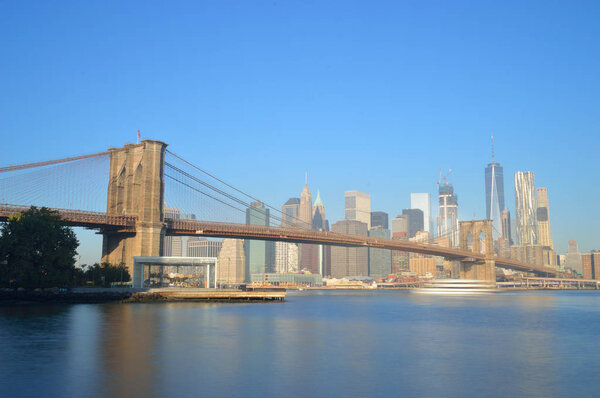 Manhattan skyline with Brooklyn Bridge - long exposure image.