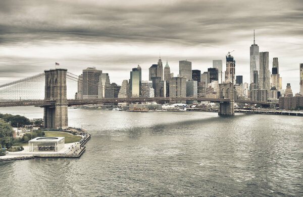 Manhattan skyline with Brooklyn Bridge at twilight - HDR image.