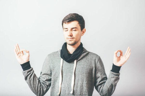 man meditating in photo studio background