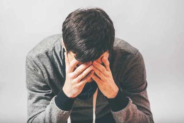 man in despair in photo studio background