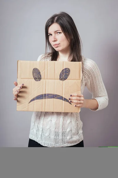 Chica Sosteniendo Triste Smiley —  Fotos de Stock