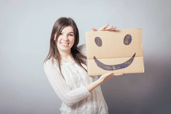 Chica Sosteniendo Feliz Smiley —  Fotos de Stock