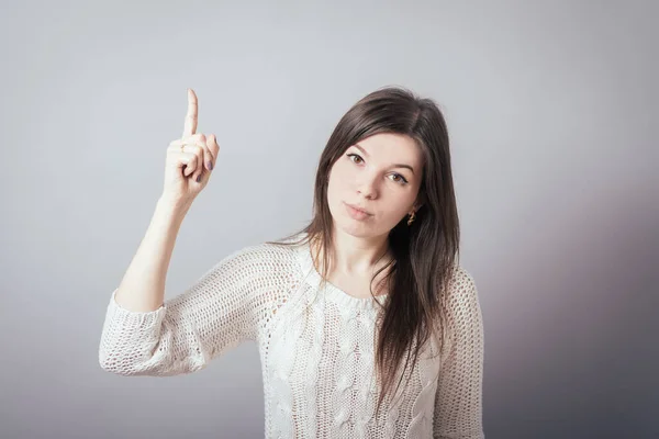 Girl Shows Index Finger — Stock Photo, Image