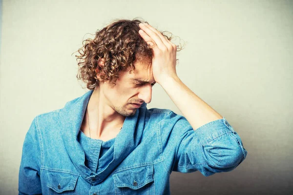 Curly Man Made Mistake Clings His Forehead Hands — Stock Photo, Image