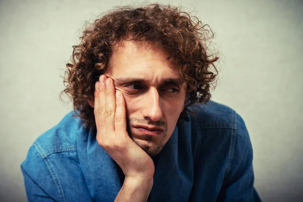 Curly Haired Man Leaned His Chin Hand — Stock Photo, Image