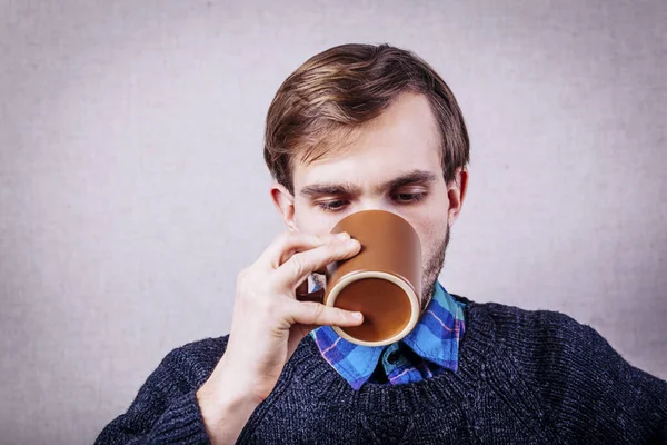 Men drinking coffee. Close-up of men drinking coffee outdoors