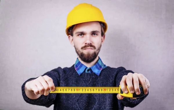 Young Builder Yellow Tape Measure — Stock Photo, Image