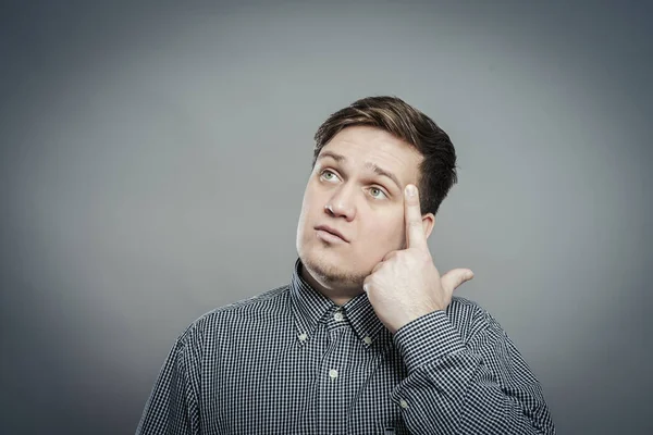 Young Guy Thinks His Finger His Temple — Stock Photo, Image