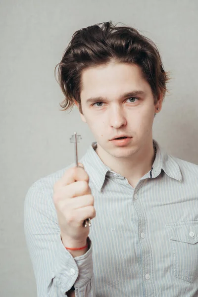 Cheerful Corporate Man Holding Key — Stock Photo, Image