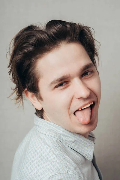 Man Shows Tongue Studio — Stock Photo, Image