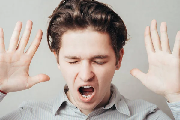 Retrato Joven Haciendo Stop Símbolo Sobre Fondo Gris —  Fotos de Stock