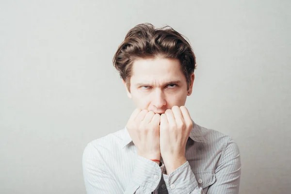 Unhappy Man Bites His Nails — Stock Photo, Image