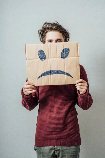 Hombre Sosteniendo Sonrisa Triste —  Fotos de Stock