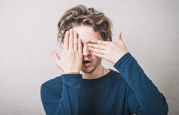 Young Man Eyes His Hands — Stock Photo, Image