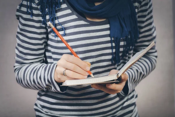 Young Woman Writes Something Notebook — Stock Photo, Image