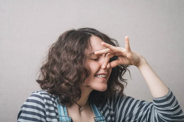 Woman Closed Her Nose Stench Bad Smell Gray Background — Stock Photo, Image