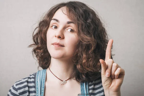 Woman Shows Index Finger Idea Gray Background — Stock Photo, Image