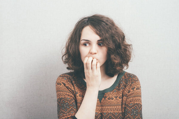 woman bites his nails