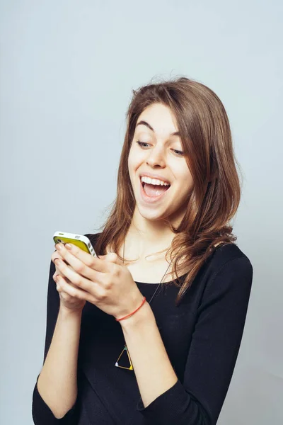 Funny Cute Brunette Girl Dials Sms Mobile Phone — Stock Photo, Image
