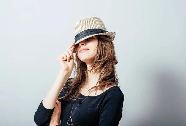 Portrait of a Beautiful Young Woman in hat