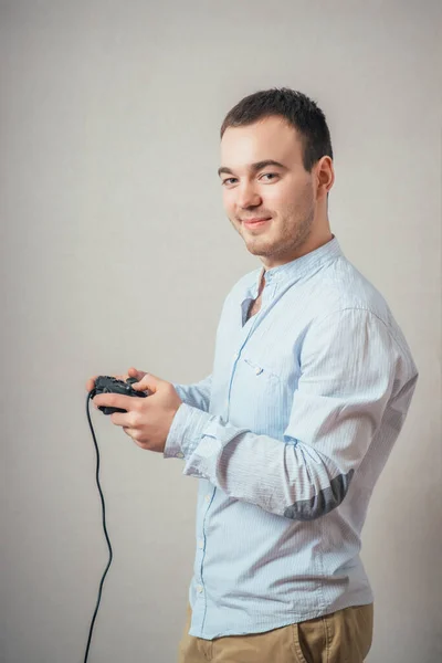 Happy Young Man Winning Pose Wearing Shirt Holding Video Game — Stock Photo, Image
