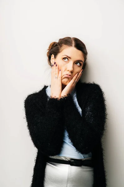 Woman thinks dissatisfied, angry, resentful. Isolated on a white background