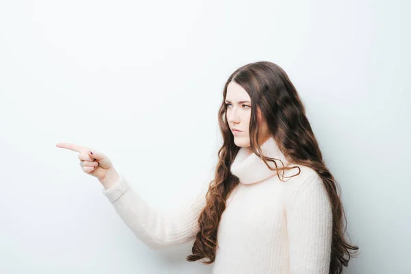 Beautiful Long Haired Girl Pointing Her Finger White Background — Stock Photo, Image