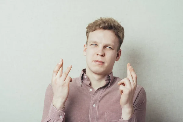 Young Man Crossed His Fingers — Stock Photo, Image