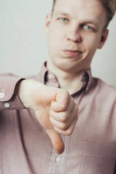 Disappointed Young Man Showing Thumb Sign — Stock Photo, Image