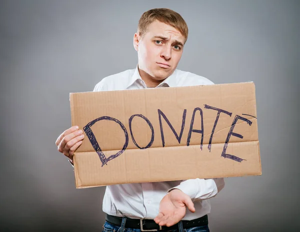 Hombre Sosteniendo Texto Cartón Una Donación —  Fotos de Stock