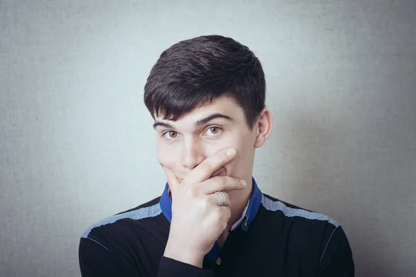 Young Man Closes His Mouth His Hand — Stock Photo, Image